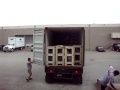 gp auto corp. auto glass 40 feet container receiving process and positioning at the warehouse dock level, for easily forklift access and auto glass pallet handling.
