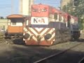 EMD GT-22CW 9042 + EMD GR-12W 6611 retrocediendo en 2º