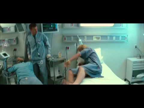 hitfixcom - Thor (Chris Hemsworth) battles a barrage of doctors and nurses whilst clad in only a gown.