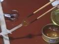 Drinking tea with chopsticks in microgravity