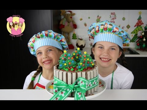 crafty - KIT-KAT CHRISTMAS CAKE with m&ms - Tutorial by Charli's crafty kitchen Sub to My Cupcake Addiction: https://www.youtube.com/user/MyCupcakeaddiction You will ...