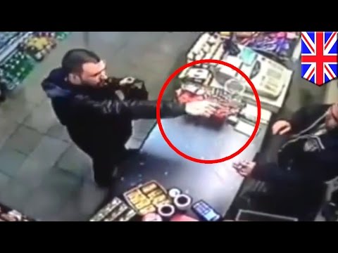 Video shows UK shop owner grab gun from stupid robber