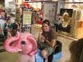 Jordan riding a pink horsey