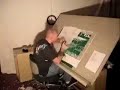Logan Hicks cutting out stencils