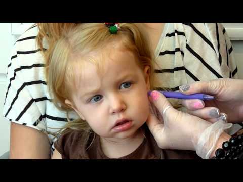 pierced - my 2 1/2 year old getting her ears pierced at Claires.