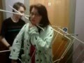 Girl stuck in cloth rack