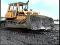Cat D8s dozing out fishing lake