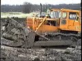 Cat D8s dozing out fishing lake
