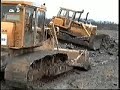 Cat D8s dozing out fishing lake