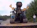 Heavy plant being loaded onto a low loader in cambridge