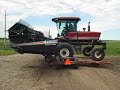 Bob loding his swather Bob loding his swather