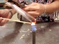 Heating of red lead(II) oxide