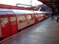 Bakerloo line tube train arriving at Kensal Green station