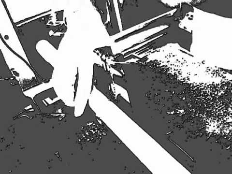 Kraftwork - Black and white animated video from Omnibus Design featuring electronic music. Close up of hands building and cutting. Industrial workshop environment.