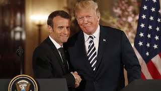 Trump and Macron share an awkward handshake and a kiss