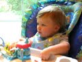 baby learns to chew apple