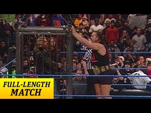mankind - Mankind and the Big Show square off for the WWE Championship on SmackDown! Triple H is hanging above the ring in a cage which guarantees no interference from...