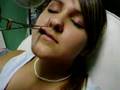 Girl Getting Herself A Lip Piercing With Piercing Device In Hand