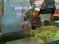Making cheese steaks at Geno's