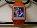 Orange MP4 Video Wristwatch playing iPhone ad