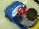 Joel is riding a car
