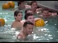 billy jumps in a pool full of waterpolo players