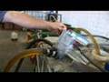 Hippy Gourmet at VegRev converting Vegetable oil to fuel!