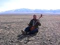 Chuluun singing hoomi before the JargalantAltai Mountains Chuluun singing hoomi before the JargalantAltai Mountains