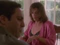 Carla Gugino (as Karen Sisco) chases a woman wearing a red robe, sexy bra and panties through a house to a fence and after a few punches exchanged, takes her down and handcuffs her, turns out to be a man with a sex change. The scene is from TV-serial 