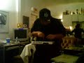 squareweezy of the fingerbangerz demonstrates his pact with the devil (standing in the background) by making his drum machine float in mid air.