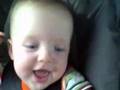 Tommy lauging in Car on the way to Dyersville