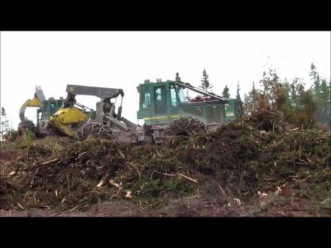 John Deere 648GIII Pushing Brush