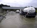 Rigs Pushing Through a Flood