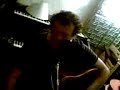 left handed frank fish strums a right handed acoustic guitar and sings 'oh god please tell me....