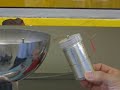 A homemade Leyden jar (original capacitor) discharges when it is charged to the maximum capacitance near a Van de Graaff.
