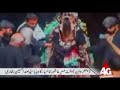 Writeup Below!Nazim Party Nauha - 2007_____________________________________Ab aey hawaoon kuch khaak urraoLoot aayi ran se Sheh ki kamaayi.Zainab ka malna hai dheen khali (x2)Zakhmi badan se hai khoon jari.1)  Zainab ki ran main Aah-o-Buka hai     Mazloom bhai batla kahan hai     Kia haal tera ye murtejil hai      Aankhon se kion ye aansoon rawan hai     Teeron se chalni sara badan hai      Sare badan se hai khoon jari2)  Tere badan se bhia ki mujh ko     Taza lahoo ki aati hai kushboo     Hai surkh kion kar ye jism tera      Kyunkar hai teri ankhon main ansoo      Baagein phati hain raagein kati hain      Kion ser pe tere hai zakhm taari3)  Aey Zuljinah-e-Sibt-e-Payamber     Batla kahan hai mera biradar      Piyasi Sakina karti hai noha     Baba na aaey maqtal se kyun kar     Maara gaya kia mazloom bhai      Karti hai Zainab ye Aah-o-Zaari4)  Har shaam Sughra Roza-e-Nabi Par     Shamma jalaane ko jaati hogi      Aashoor bhi guzraa baba na aaey      Ye soch kar wo ghabrati hogi      Veeran gher ki chokat pe ab tak      Baithi ho shayad woh gham ki maari_________________________________Courtesy of nohawriteups.com