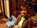 Faye on a chair