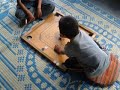 Tibetan kids playing caroms