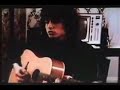 bob dylan and robbie robertson playing in a hotel room