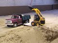 Old dump truck & Skid steer loader moving sand