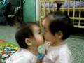 kissing baby twins