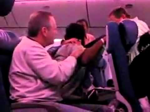 plane travel - Indian man travelling on a plane.