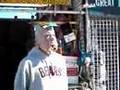 Filming man with Clinton Mask at Venice Beach California