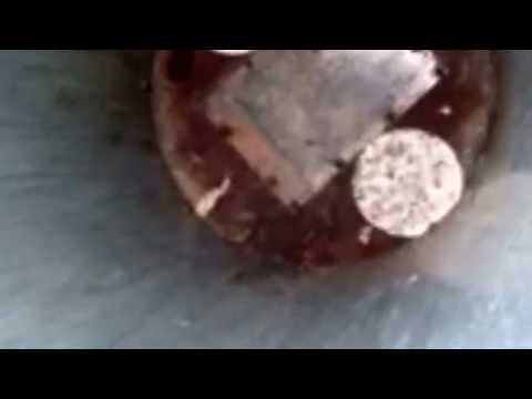 Child jokingly sits in a public trash can, not realizing the bottom opens to dispose of contents underground when the lid closes. Panic ensues.