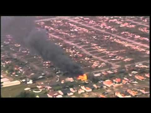 Raw - Television footage shows flattened buildings and at least one fire after a mile-wide tornado tore through the Oklahoma City area. Video shows homes and build...