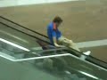 Stormchasers play leap frog on an escalator