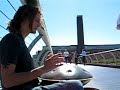 Hang drum sounds blowing in the wind.