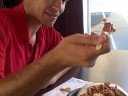 Eric demonstrates the eating of poutine during the honeymoon in Montreal.