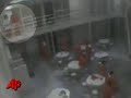 surveillance video recorded at the county jail in clovis, nm shows an inmate escaping through a small door leading to a plumber's chute.  eight inmates escaped sunday and five are still missing.  (august 28)