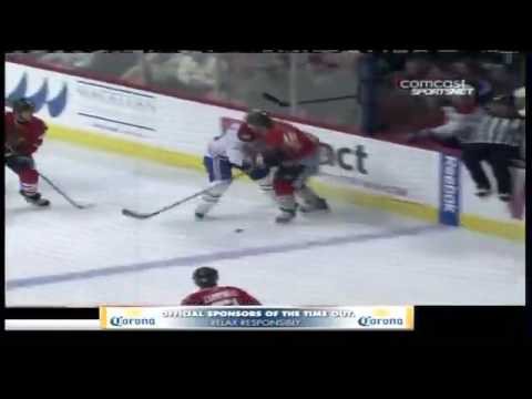 Blackhawk Andrew Ladd catches Matt D'Agostini with a monster hit Blackhawk Andrew Ladd catches Matt D'Agostini with a monster hit
